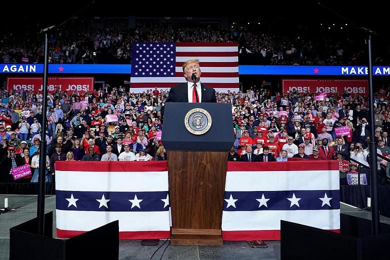President Donald Trump speaking at a campaign rally in Grand Rapids, Michigan, on Thursday. He called his opponents "losers" and celebrated the fact that the special counsel's investigation has ended.