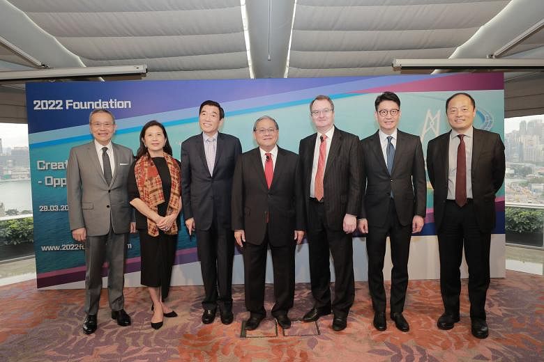 The study was carried out by a team of economists under Professor Michael Enright (third from right). It was overseen by a steering committee whose members include (from left) Mr Edward Cheng Wai-sun, deputy chairman and chief executive of Wing Tai P