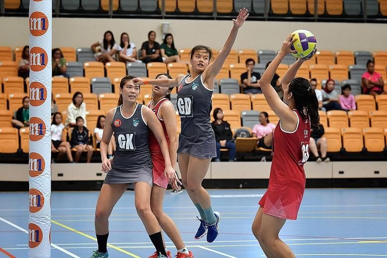 Llabten Narwhals' 17-year-old player Rachel Ling jumping to block the Swifts goal shooter. Narwhals won 54-49 to secure a semi-final spot.