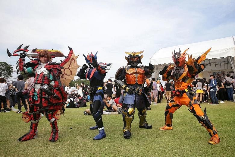 Cosplayers dressed up as a Japanese schoolgirl (above), as well as Ryuk (left) from anime Death Note, and characters (from far left) Monster Hunter, Kamen Rider Cross-Z, SIC Kamen Rider Gaim and Kamen Rider Cross-Z Magma striking a pose at the Sakura