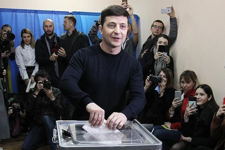 Ukrainian comedian and presidential candidate Volodymyr Zelenskiy casting his ballot at a polling station in Kiev, Ukraine, yesterday.