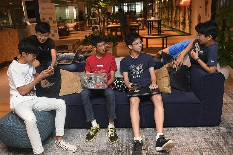 Five students - (from left) Chai Jia Cheng, Rafael Soh, Ng Mun Hin, Heng Teng Yi and Robert Xiu - have co-founded a start-up to create a mobile payment and financial platform for teenagers.
