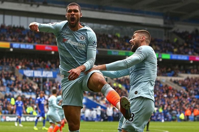 Left: Chelsea substitute Ruben Loftus-Cheek celebrating scoring the last-gasp winner with teammate Olivier Giroud in the 2-1 win against Cardiff City yesterday. Below: Cesar Azpilicueta heading in the equaliser for Chelsea but replays showed he was c