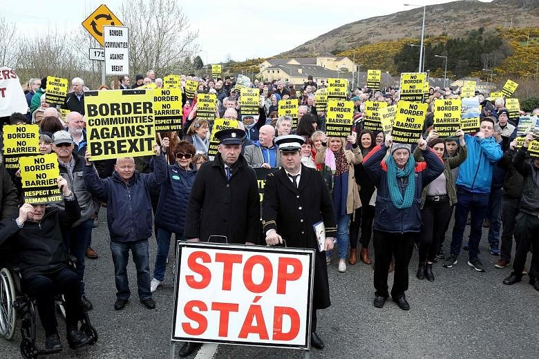 Protesters at the Carrickcarnan border between Newry in Northern Ireland and Dundalk in Ireland on Saturday. The British Parliament is due to vote today on a range of alternative Brexit options, including a no-deal exit, preventing a no-deal exit, a 