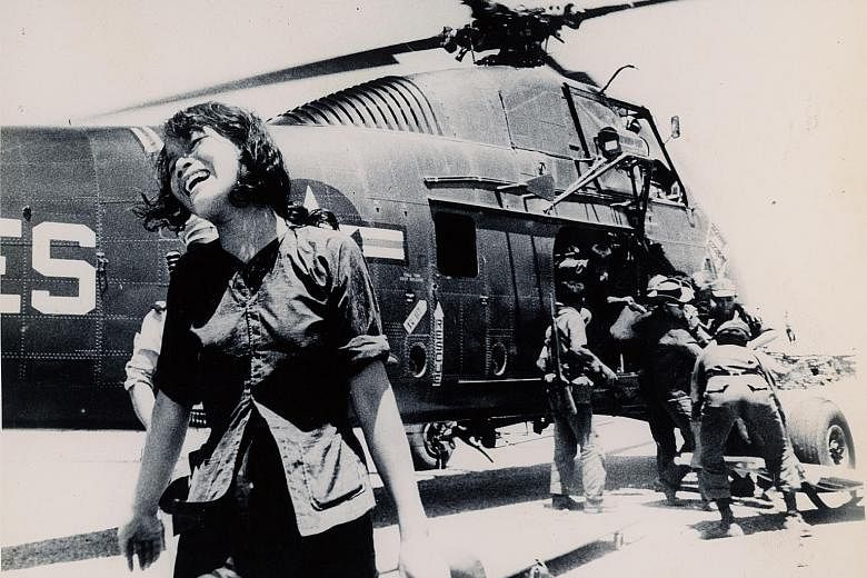 A widow and her killed-in-action husband being evacuated to Quang Ngai airstrip in 1965.