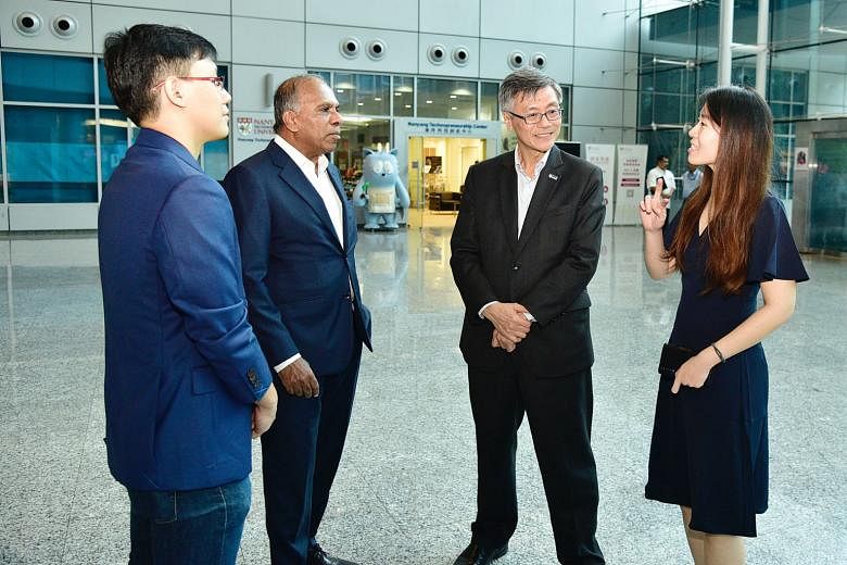 Interacting together after the signing ceremony of the collaborative exchange programme for PhD students held at the NTU Research Techno Plaza are (from left): PhD student Teng Ting Shien from Nanyang Technological University; Professor Subra Suresh,