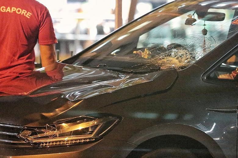 The impact from the collision damaged the front of the car. The driver has been arrested. PHOTO: SHIN MIN DAILY NEWS