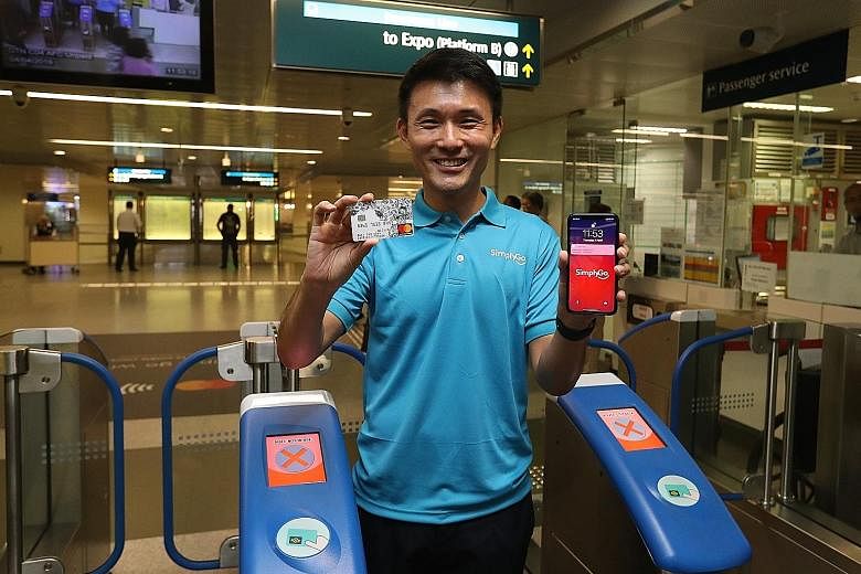 Left: To use SimplyGo, commuters tap the fare gantry with their Mastercard or mobile phone, which must already have Apple Pay, Fitbit Pay, Google Pay or Samsung Pay available. Above: Senior Parliamentary Secretary for Transport Baey Yam Keng said Sim