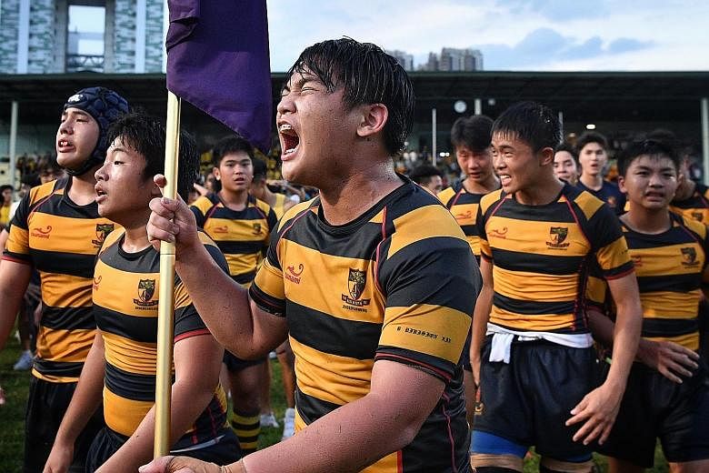 Anglo-Chinese School (Independent) players (in blue and yellow) recycled the ball from flank to flank before finding the gaps to beat St Andrew's Secondary School in the Schools National B Division rugby final at the Queenstown Stadium yesterday. Bel