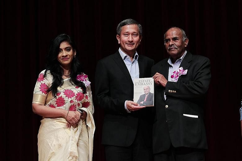 Foreign Minister Vivian Balakrishnan and veteran diplomat K. Kesavapany (right) at the launch of the former high commissioner's biography. The book is co-authored by applied linguist Anitha Devi Pillai (left).