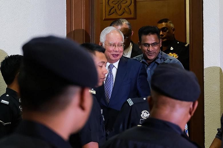 Former Malaysian prime minister Najib Razak exiting a court room at the Kuala Lumpur Courts Complex on Wednesday. He is alleged to have received RM42 million in his personal account from SRC International.
