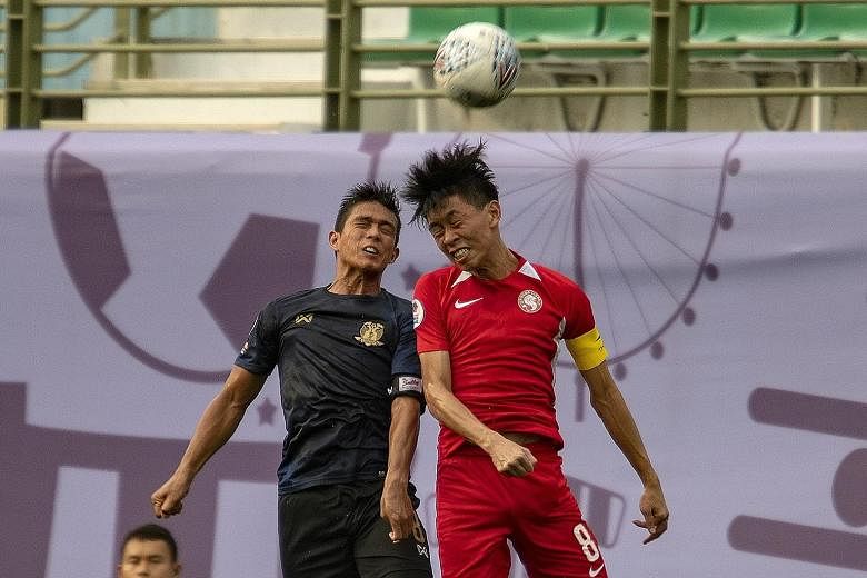 Young Lions captain Joshua Pereira challenging Hougang United's Hafiz Sujad in their 2-1 Singapore Premier League win last Sunday.