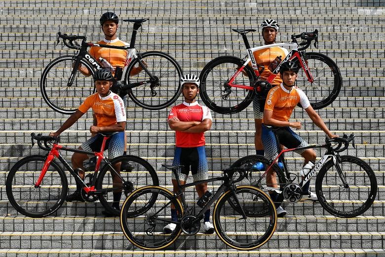 SCDF cycling team leader Ahmad Ridhwan Dahlan (in red) and his team members (clockwise from his right) Yazid Amir, Syed Amir Haziq, Shuhrawardi Hussain and Suhardi Sa'ad train twice to thrice a week, cycling about 40km each time. They also cycle some