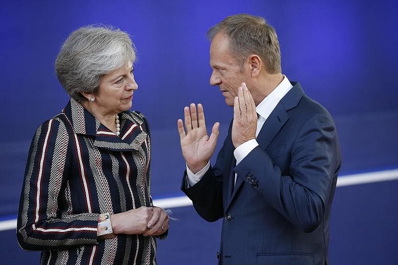 British Prime Minister Theresa May meeting European Council President Donald Tusk at a summit in Brussels last year. Mr Tusk, who will convene a meeting of EU leaders on Wednesday, plans to propose a longer Brexit postponement of one year for Britain