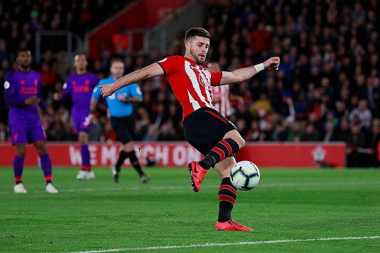 Top: Southampton's Shane Long putting the hosts ahead after just nine minutes in their match against Liverpool at St Mary's Stadium on Friday. Above: Liverpool captain Jordan Henderson scoring their third goal against Southampton. The Reds won 3-1.