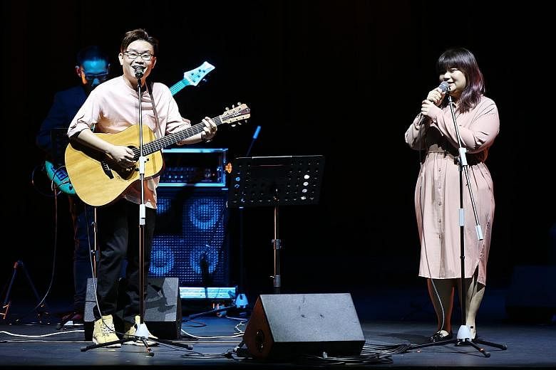 Musician Ariane Goh with Malaysian singer-songwriter Wu Jiahui, performing the song One Half, at the wrap-up of Sing Our Song.