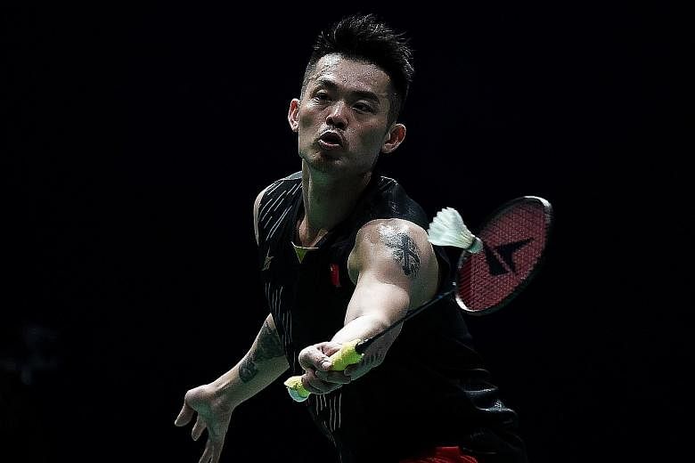 China's Lin Dan hitting a shot against compatriot Chen Long in the men's singles final of the Malaysia Open yesterday. His last victory came at the same tournament in 2017.