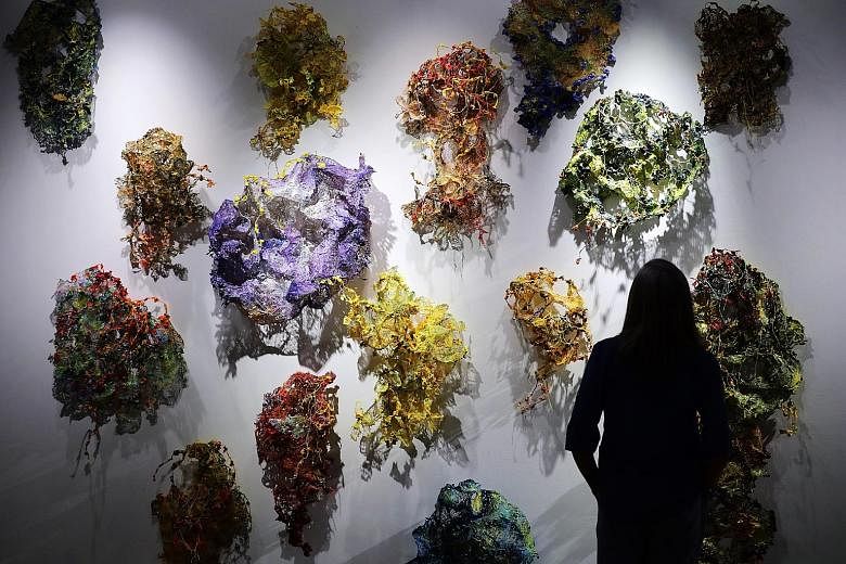 Urban Veil by Nandita Mukand features about 15 colourful works made of cloth stiffened with acrylic, plaster and resin. They are inspired by forms of natural decay.