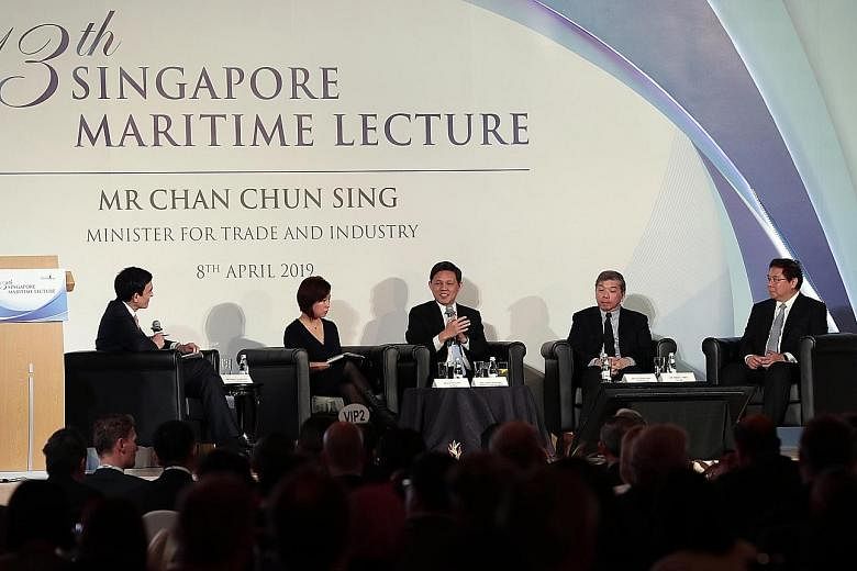 Trade and Industry Minister Chan Chun Sing (centre) at the panel discussion after delivering the 13th Singapore Maritime Lecture yesterday, with (from left) Singapore Maritime Foundation chairman Andreas Sohmen-Pao, 500 Startups China partner Edith Y