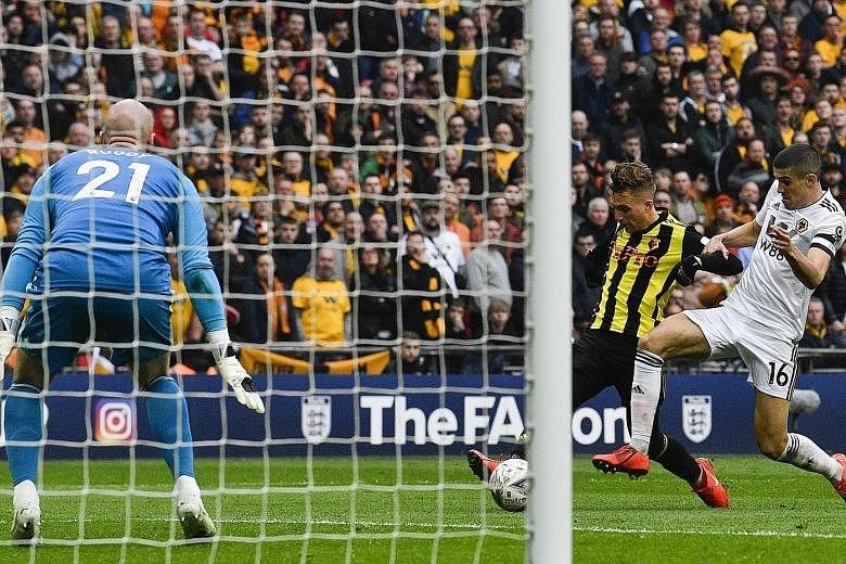 Watford winger Gerard Deulofeu holding off Conor Coady to score past Wolves goalkeeper John Ruddy in extra time of their FA Cup semi-final at Wembley on Sunday. Watford's 3-2 win earned them a final showdown against Manchester City on May 18.