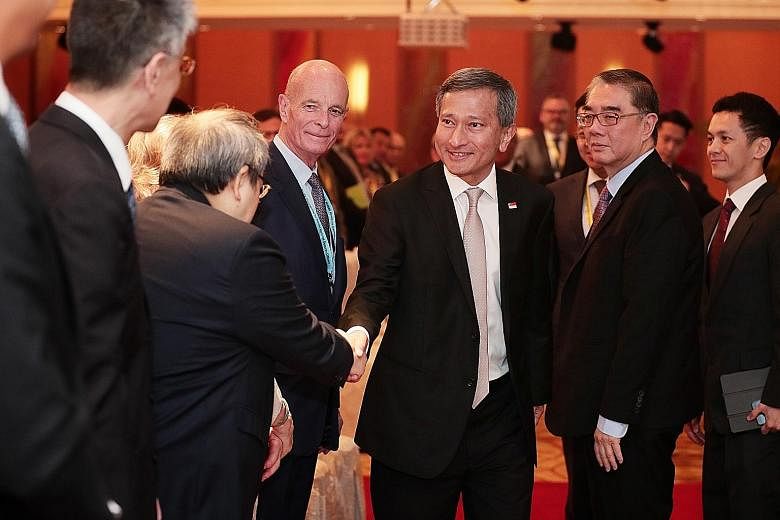 Foreign Minister Vivian Balakrishnan and Ambassador Ong Keng Yong (second from right), executive deputy chairman of the S. Rajaratnam School of International Studies, at the conference yesterday.