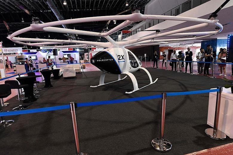 A Volocopter 2X on display at a media preview at the Rotorcraft Asia 2019 and Unmanned Systems Asia 2019 exhibition held at the Changi Exhibition Centre. The air taxis will initially take flight with a pilot, as it would be easier for the company to 