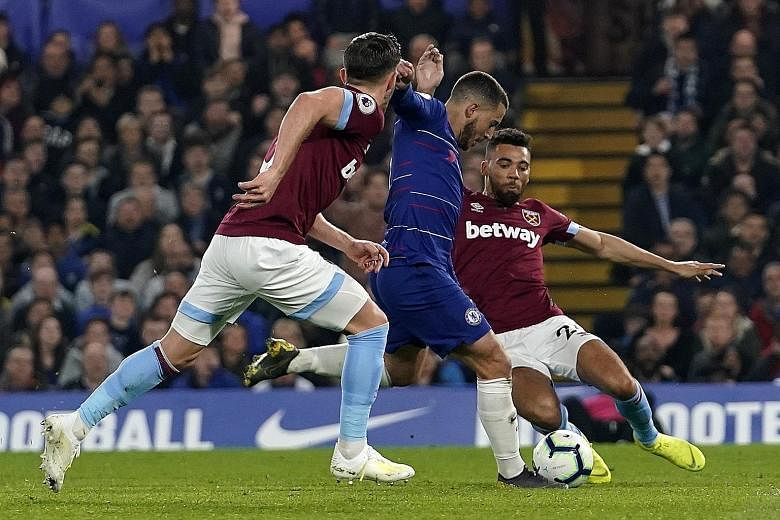 Eden Hazard capping a fine solo run to score Chelsea's opener against West Ham at Stamford Bridge. The Belgian added another to lead the Blues to a 2-0 win and third place in the Premier League.