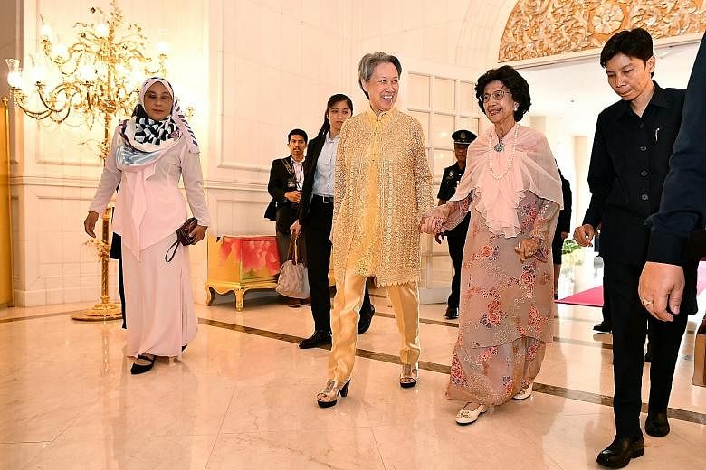 Left: Prime Minister Lee Hsien Loong with Malaysian Prime Minister Mahathir Mohamad at Seri Perdana, the latter's official residence, where the Malaysian leader and his wife hosted a lunch in honour of PM Lee and his wife yesterday. Below: Mrs Lee wi