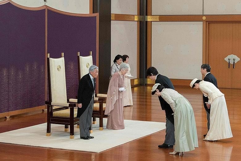 Left: Emperor Akihito and Empress Michiko being congratulated by (from far right) Crown Prince Naruhito, Crown Princess Masako, Prince Akishino and Princess Kiko during the celebration of the 60th anniversary of their wedding yesterday at the Imperia