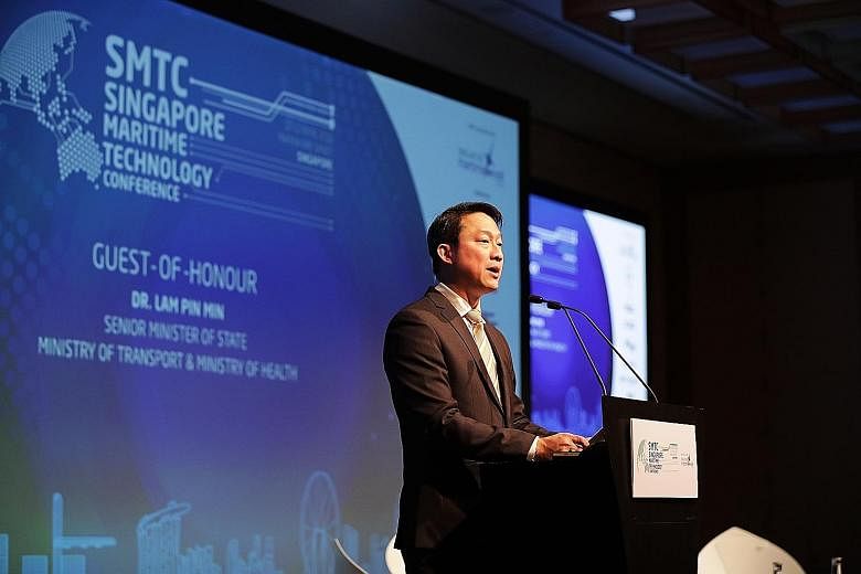 Senior Minister of State for Transport Lam Pin Min speaking at the Singapore Maritime Technology Conference. The Sea Transport Industry Digital Plan will provide SMEs with a step-by-step guide to digitalisation. ST PHOTO: GIN TAY
