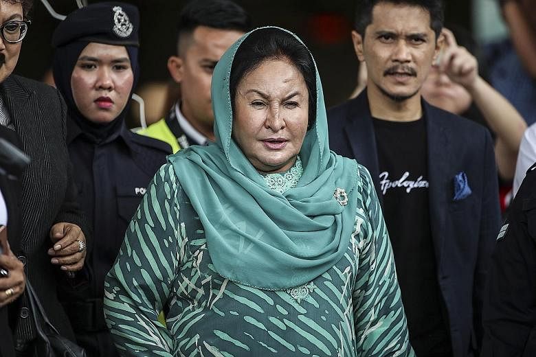 Rosmah Mansor, the wife of former Malaysian prime minister Najib Razak, leaving the Kuala Lumpur High Court yesterday. She is accused of receiving a RM5 million (S$1.7 million) bribe relating to a solar power project. PHOTO: EPA-EFE