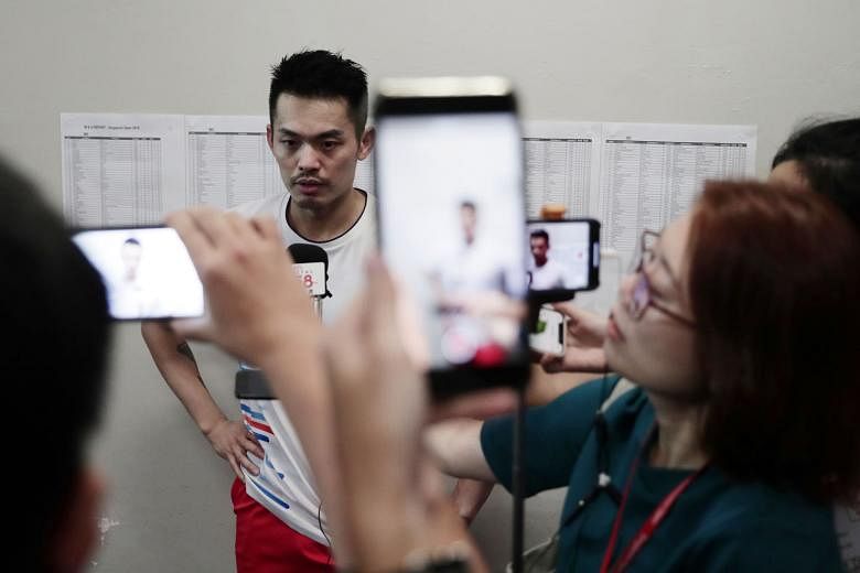 China's Lin Dan talking to journalists at the Singapore Indoor Stadium after he retired in the first game when he was 20-13 down against Dane Viktor Axelsen. He is no stranger to controversy at the Singapore Open - from being a no-show at the pre-tou
