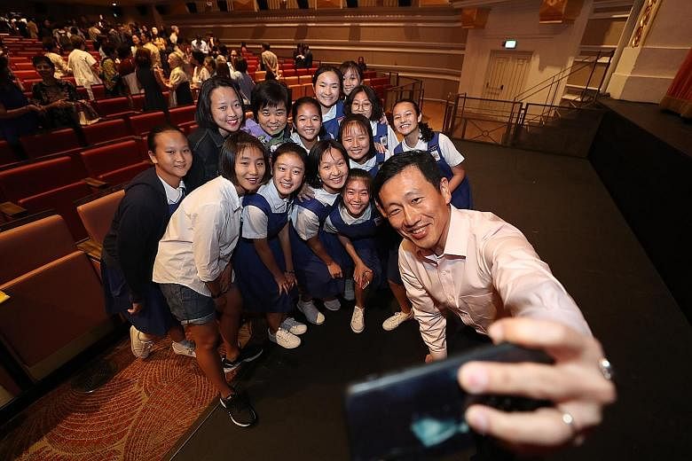 Education Minister Ong Ye Kung with cast members from a film about CHIJ St Nicholas Girls' School at its premiere at Capitol Theatre yesterday. ST PHOTO: TIMOTHY DAVID
