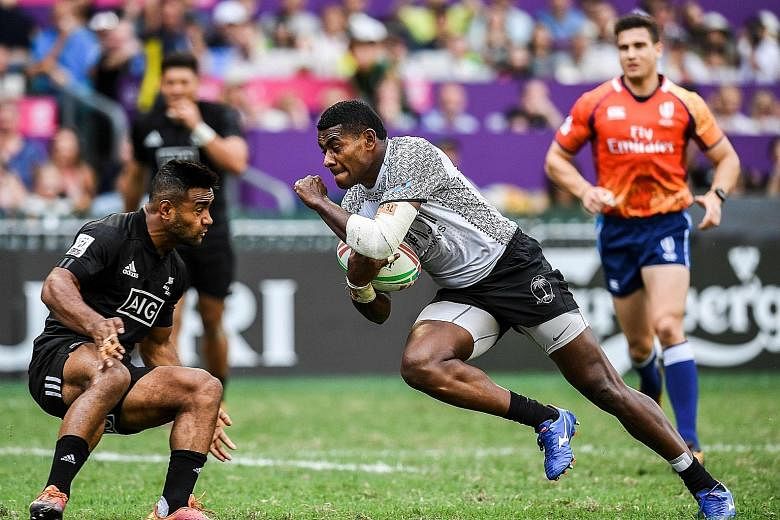 Jona Nareki of New Zealand attempting to stop Apenisa Cakaubalavu in their 24-5 Pool C defeat by Fiji at last weekend's Hong Kong Sevens. The All Blacks Sevens finished sixth, their worst tournament showing in more than a year, and have work to do to