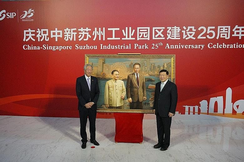Deputy Prime Minister Teo Chee Hean and Jiangsu party secretary Lou Qinjian launching the China-Singapore Cooperation Gallery to mark the Suzhou Industrial Park's 25th anniversary. Behind them is a silk embroidery by Yao Jianping that replicates a 20
