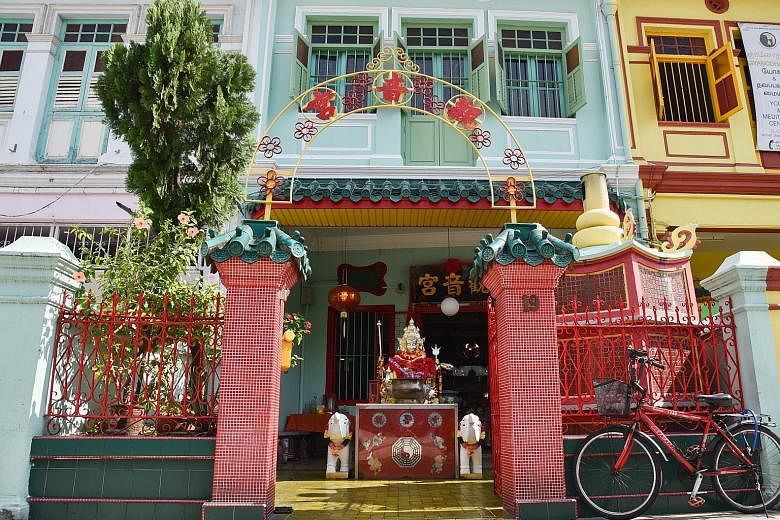 Fengzhu Gu (left) praying at the Guanyin Gong vegetarian hall in Cuff Road. Dr Show Ying Ruo (at left in centre picture), who studied these halls, says the shophouse that is home to the hall (right) was bought for $30,000.