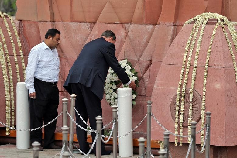 British High Commissioner to India Dominic Asquith laying a wreath yesterday to pay respects to the hundreds of unarmed men, women and children who were gunned down by colonial troops in the northern Indian city of Amritsar on April 13, 1919. British