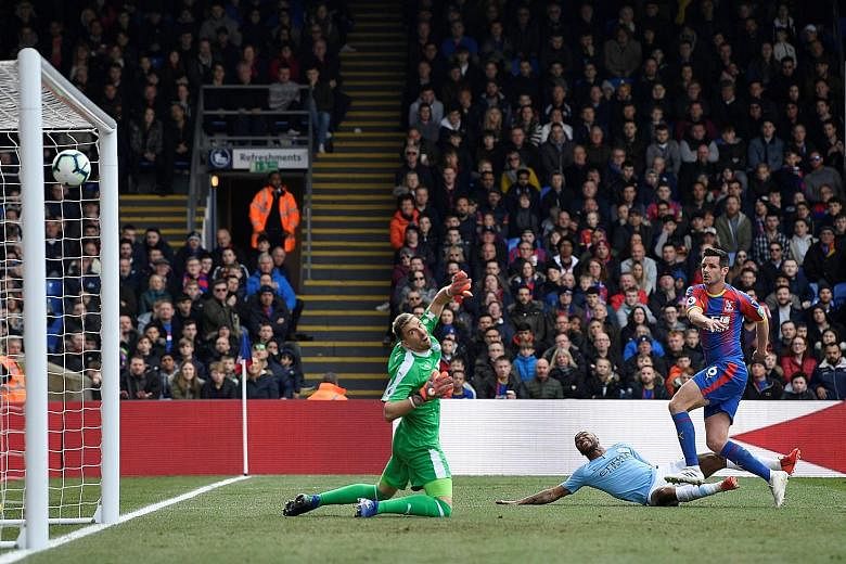 Manchester City forward Raheem Sterling scoring from an acute angle to give the Premier League defending champions the lead in the 3-1 win over Crystal Palace at Selhurst Park yesterday.