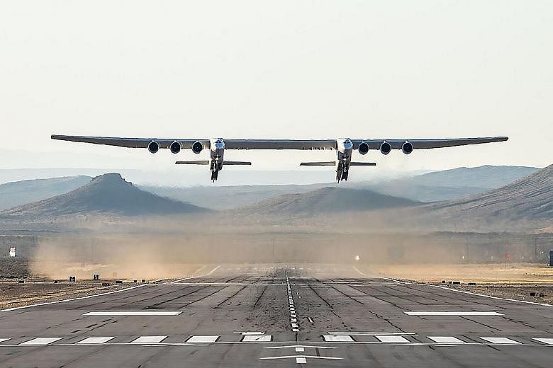 The white airplane called Roc has a 110m wingspan and is powered by six engines on a twin fuselage. It took off shortly before 10pm Singapore time on Saturday and flew for more than two hours before landing safely back at the Mojave Air and Space Por