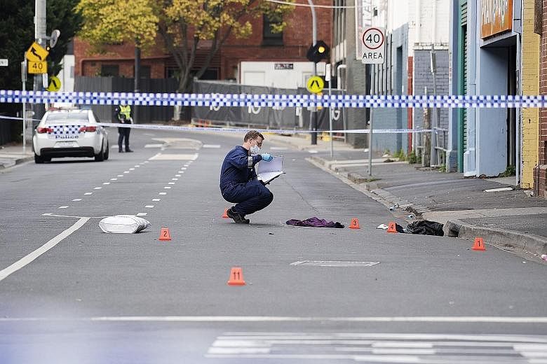 Police officers at the scene yesterday of the shooting outside the Love Machine nightclub in Melbourne's south-eastern suburb of Prahran that killed a security guard and wounded three others. There was no suggestion yet that the attack was terror-rel