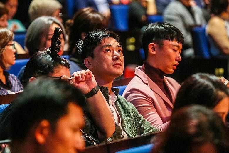 Siblings Kenny (centre) and Jefferson Pang, brothers of the late Aloysius Pang, at the awards. A video was played in tribute to the late actor. Chen Hanwei and Zoe Tay, winners of the Best Actor and Best Actress awards. They played a married couple i