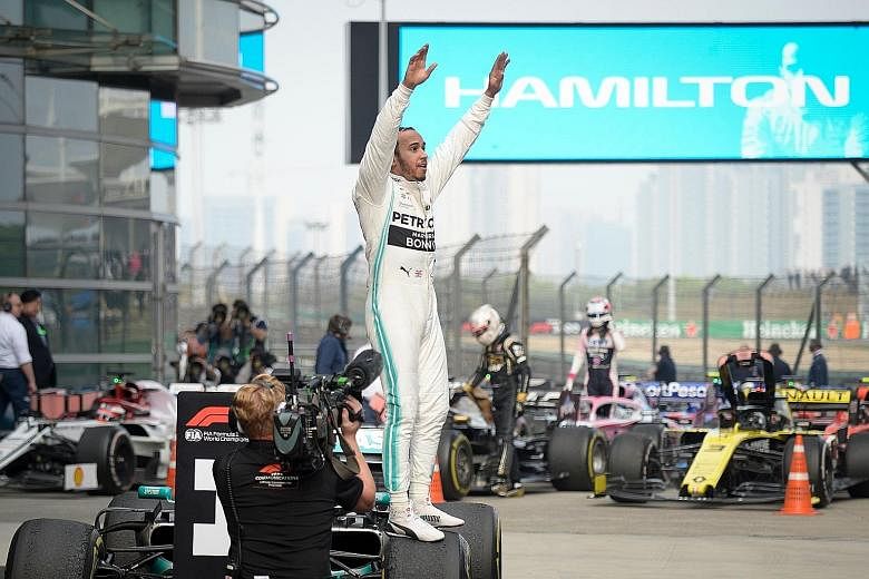 Lewis Hamilton celebrating after winning the Formula One Chinese Grand Prix in Shanghai yesterday. His sixth China win and 75th overall gave him a six-point lead over teammate Valtteri Bottas. He is 31 points ahead of Ferrari's Sebastian Vettel.
