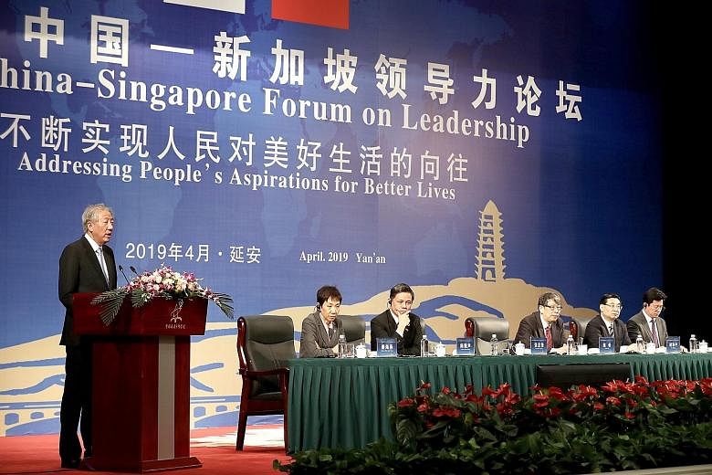 Deputy Prime Minister Teo Chee Hean giving the opening address at the 7th Singapore-China Forum on Leadership yesterday at the China Executive Leadership Academy in Yan'an in Shaanxi province. Also on the panel were (from left) Minister for Culture, 