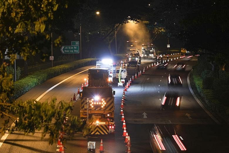 Road resurfacing on the PIE last Saturday. The resurfacing is being carried out from midnight to 4.30am to minimise traffic disruption. ST PHOTO: ONG WEE JIN