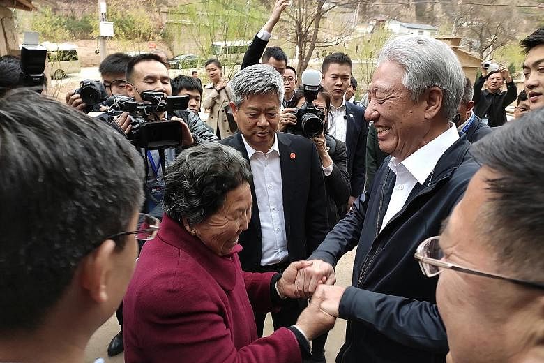 Singapore Deputy Prime Minister Teo Chee Hean interacting with villagers at Liangjiahe village, Yanchuan county, yesterday. The village is where Chinese President Xi Jinping spent seven years as a sent-down youth between 1969 and 1975 as the Cultural