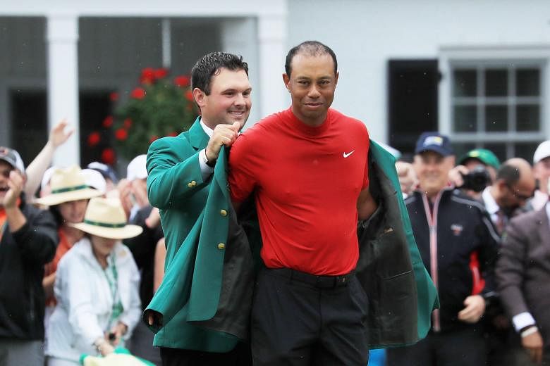 Left: Last year's champion Patrick Reed helping Tiger Woods put on the Green Jacket. Above: Soon after Woods won, he hugged his son Charlie at almost the exact spot he hugged his late father Earl (right) back in 1997 when Woods won his first Masters 
