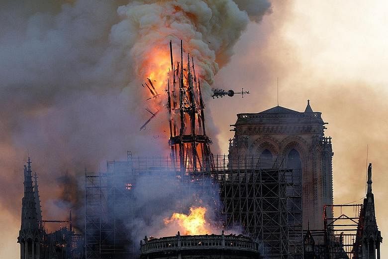 Going, going, gone: The spire atop France's Notre-Dame Cathedral is engulfed in flames, before collapsing. PHOTOS: AGENCE FRANCE-PRESSE