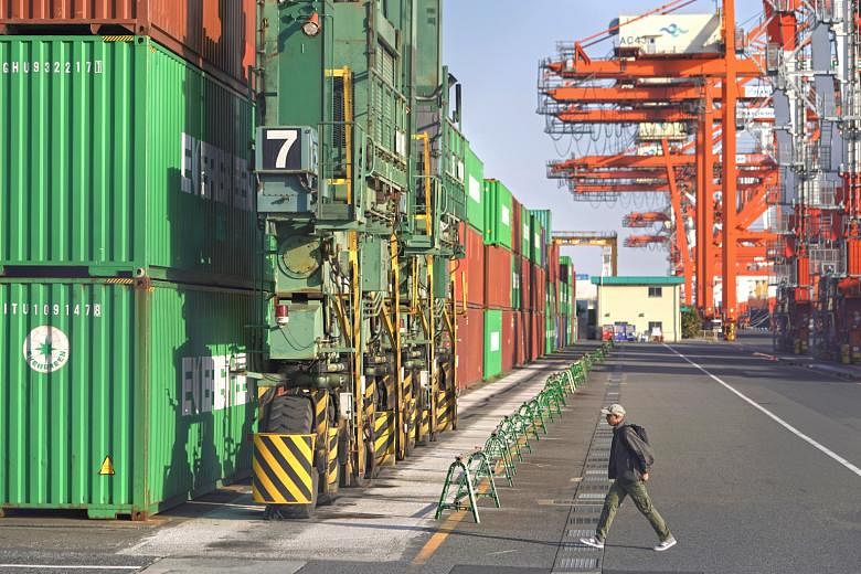 A container terminal in Tokyo. US trade officials have spelt out 22 specific negotiation areas, including non-tariff barriers in Japan's car market and currency. PHOTO: BLOOMBERG