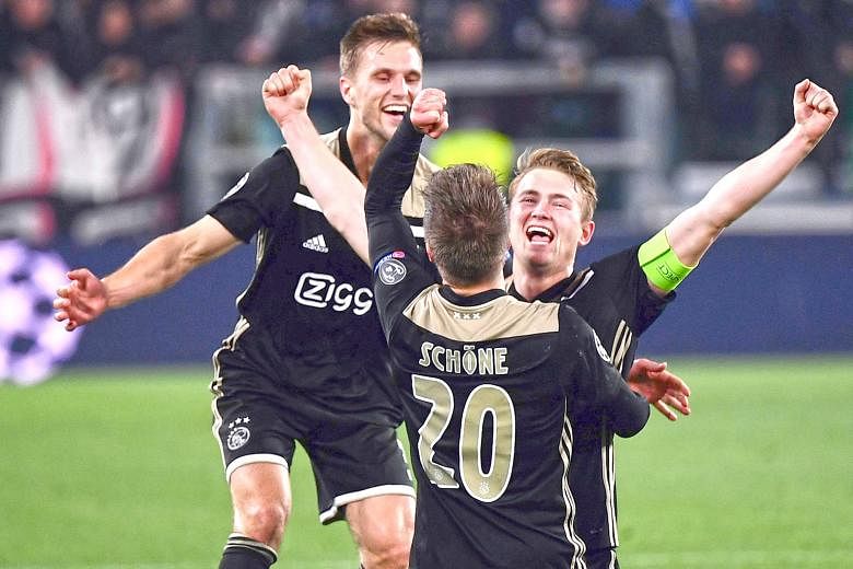 From left: Ajax defender Joel Veltman, midfielder Lasse Schone and defender Matthijs de Ligt celebrating after defeating Juventus 2-1 in the second leg of the Champions League quarter-final in Turin on Tuesday. The Dutch team won 3-2 on aggregate and