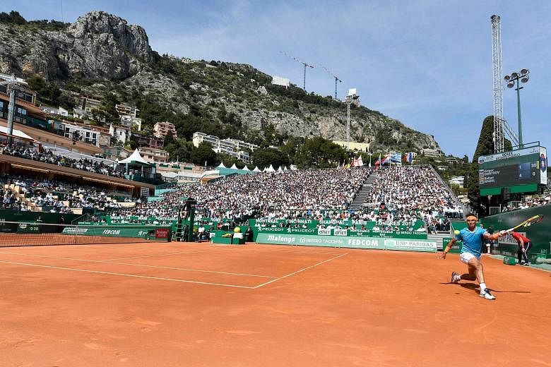 Nice view, nice weather, nice court for Spain's Rafael Nadal, while returning to Bulgaria's Grigor Dimitrov in his 6-4, 6-1 win at the Monte Carlo Masters yesterday. PHOTO: AGENCE FRANCE-PRESSE